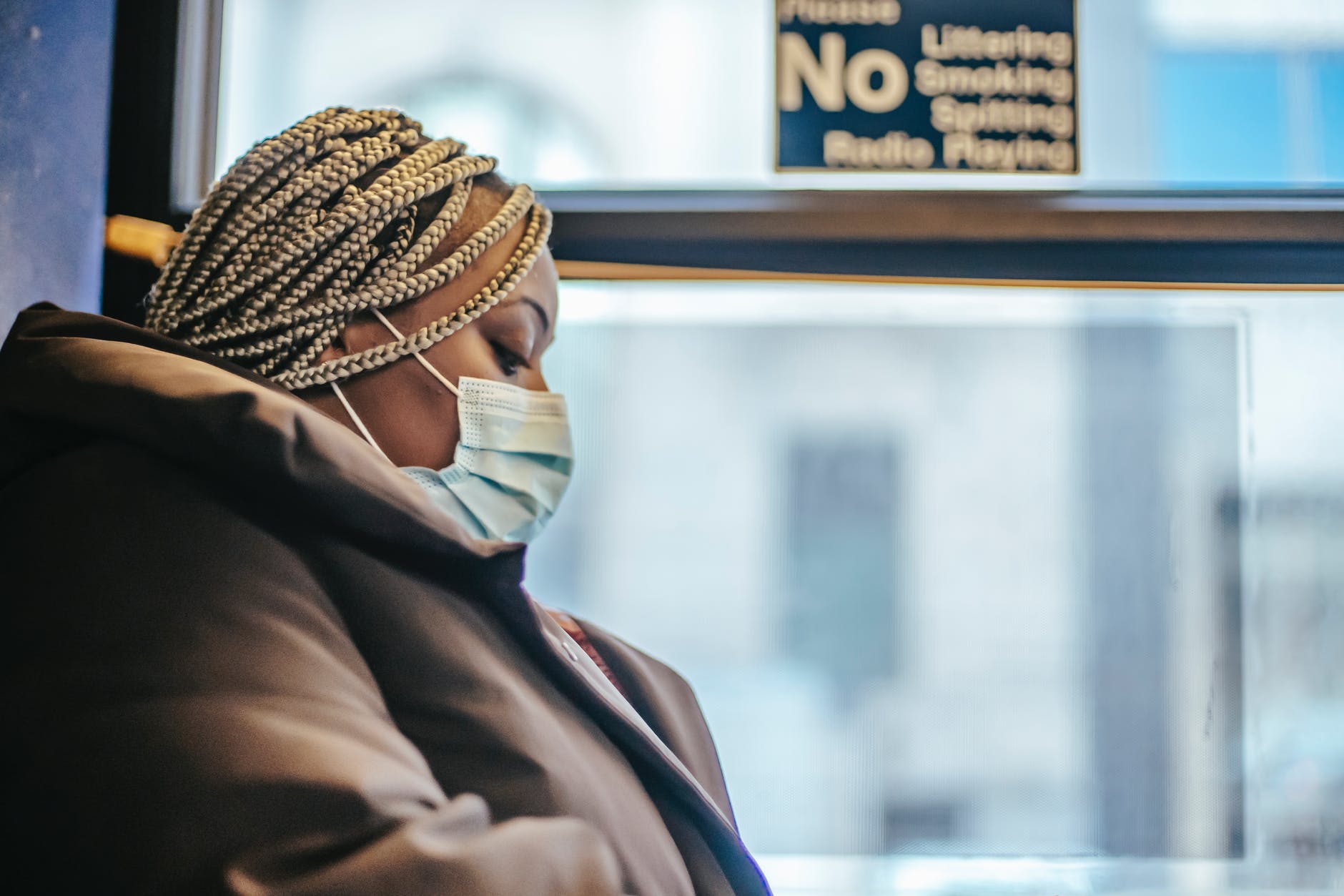 black woman in epidemic riding in bus